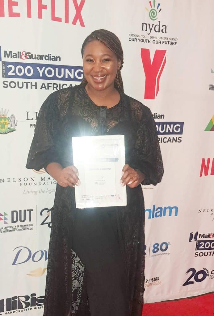 Tshepiso posing with her recognition certificate